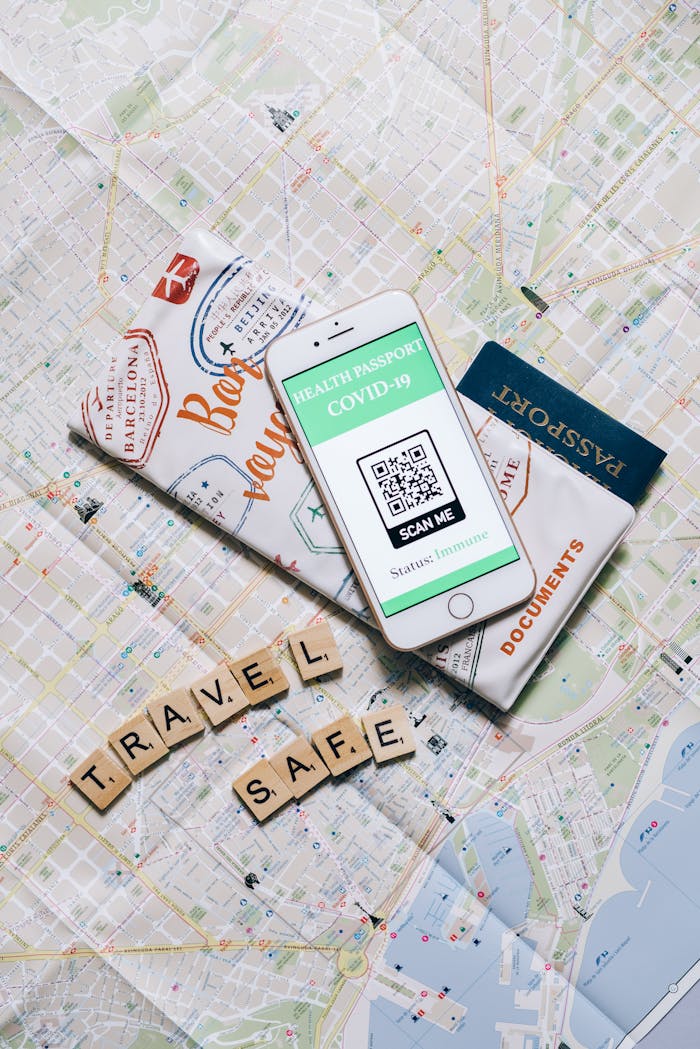Smartphone displaying COVID-19 health passport on map indicating safe travel.